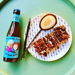 Coconut & Vanilla beer bottle with food