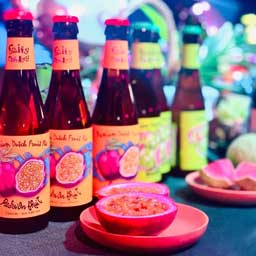 Passion Fruit in front of Passion Fruit beer bottles