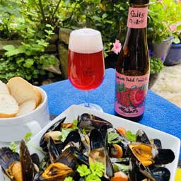 Strawberry beer bottle and glass with mussels