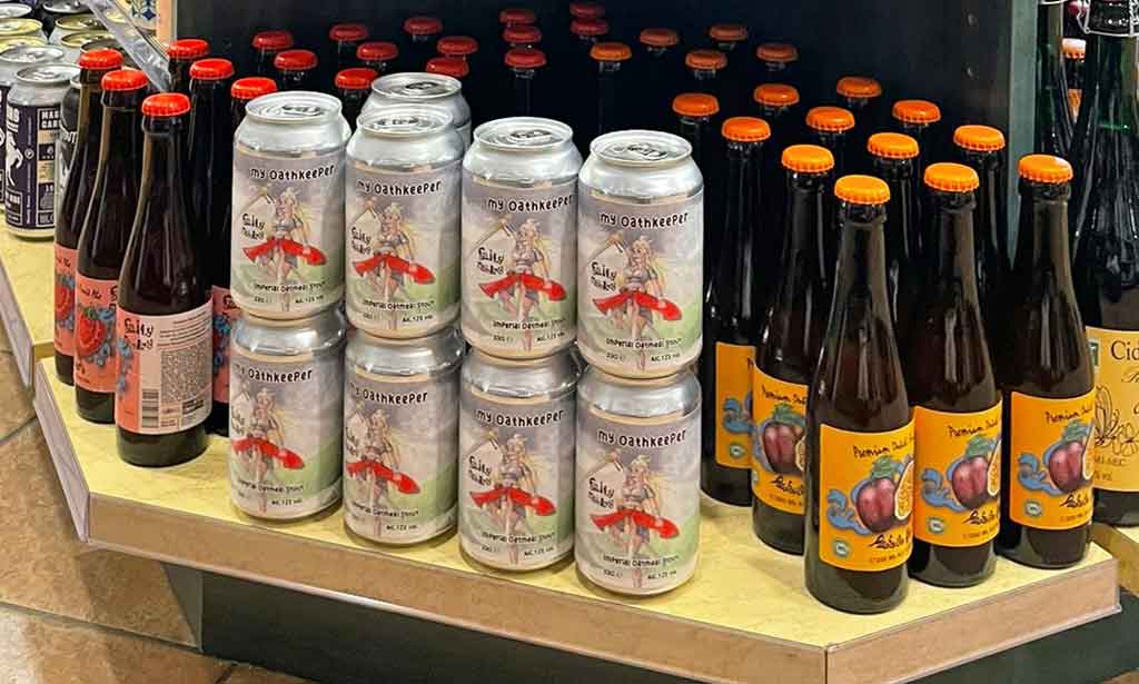 cans of beer on liquor store shelves