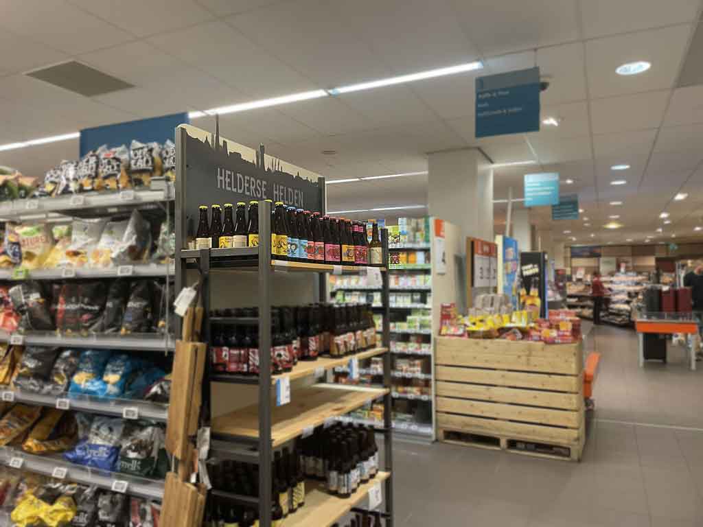 Local beers on the supermarket shelf in a convenience store