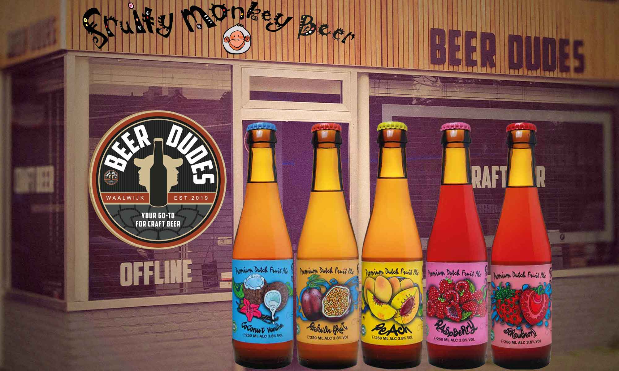 Five fruit beer bottles shown in front of a bottle shop photographed in subdued lighting