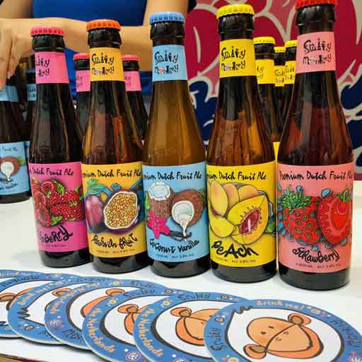 Colourfully labelled bottles of beer, each containing a different fruit flavour